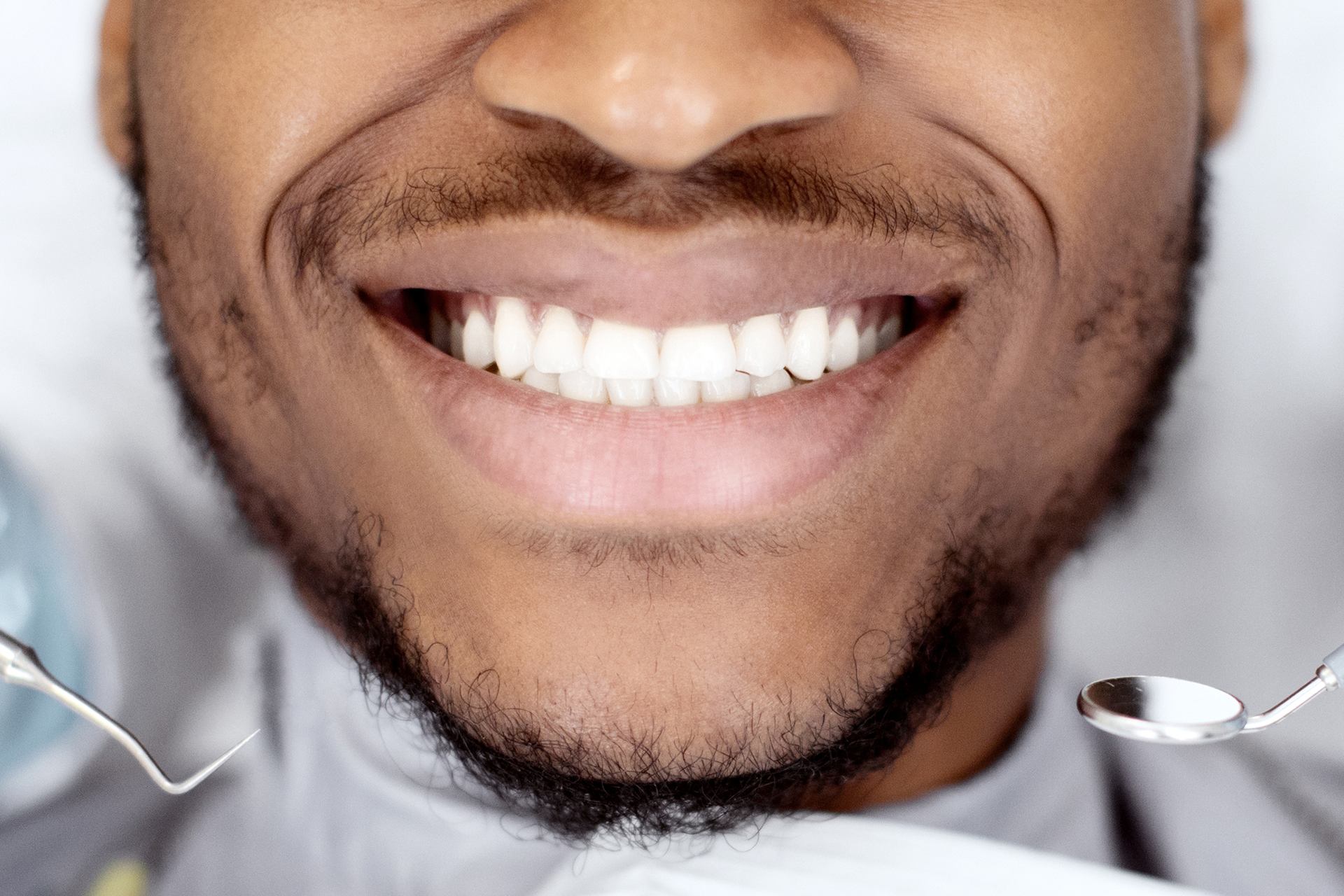 medium-vecteezy_cropped-shot-of-smiling-black-male-patient-getting-treatment_53362548_medium 1