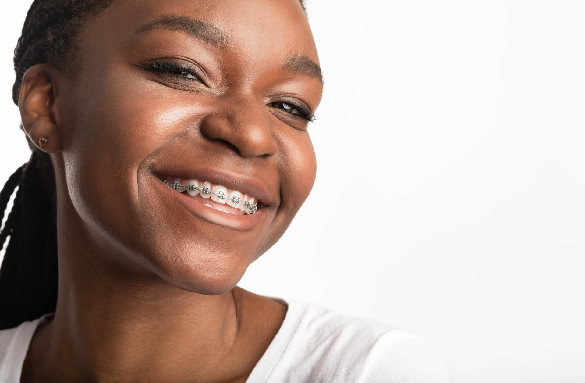 medium-vecteezy_portrait-of-black-girl-in-dental-braces-smiling-to-camera_53362147_medium (1)