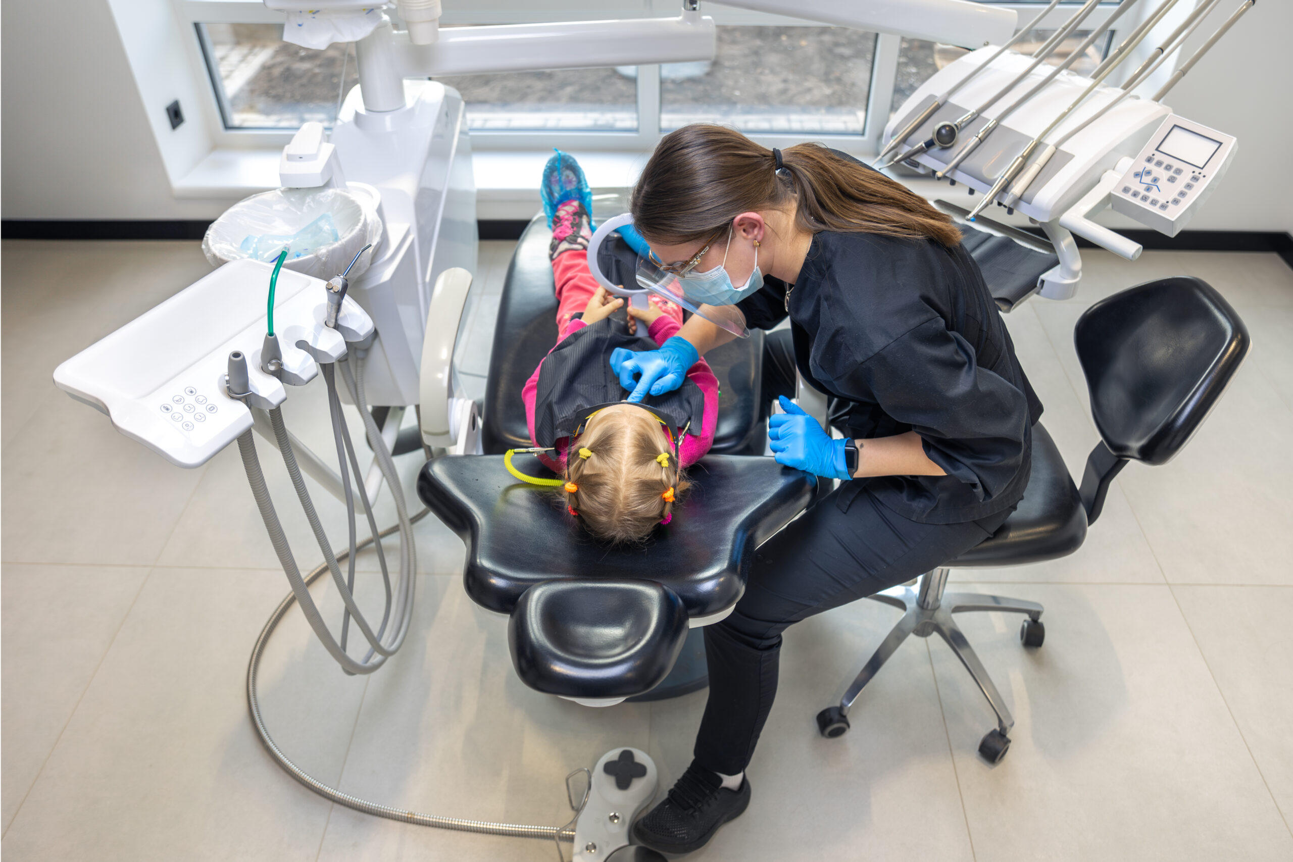 young-female-dentist-work-dentistry-treatment-childrens-teeth